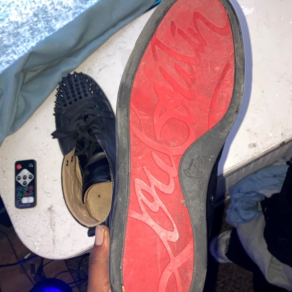 Christian louboutins with the spikes all black with the red on the bottom. - Picture 2 of 3